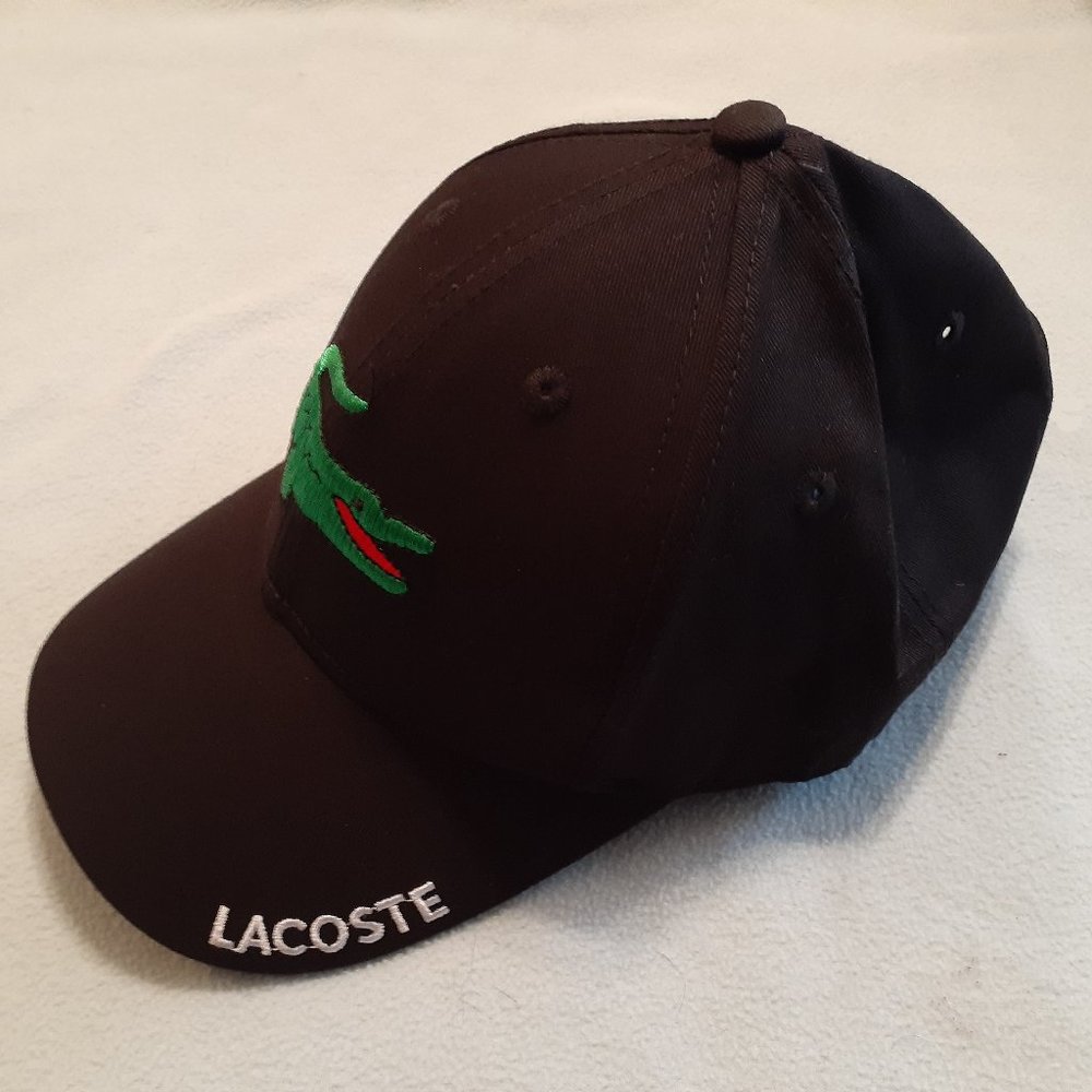 Lacoste one size fits all, with adjustable strap on the back, Black, NEW